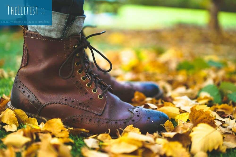 close up photo of person wearing brown leather boots